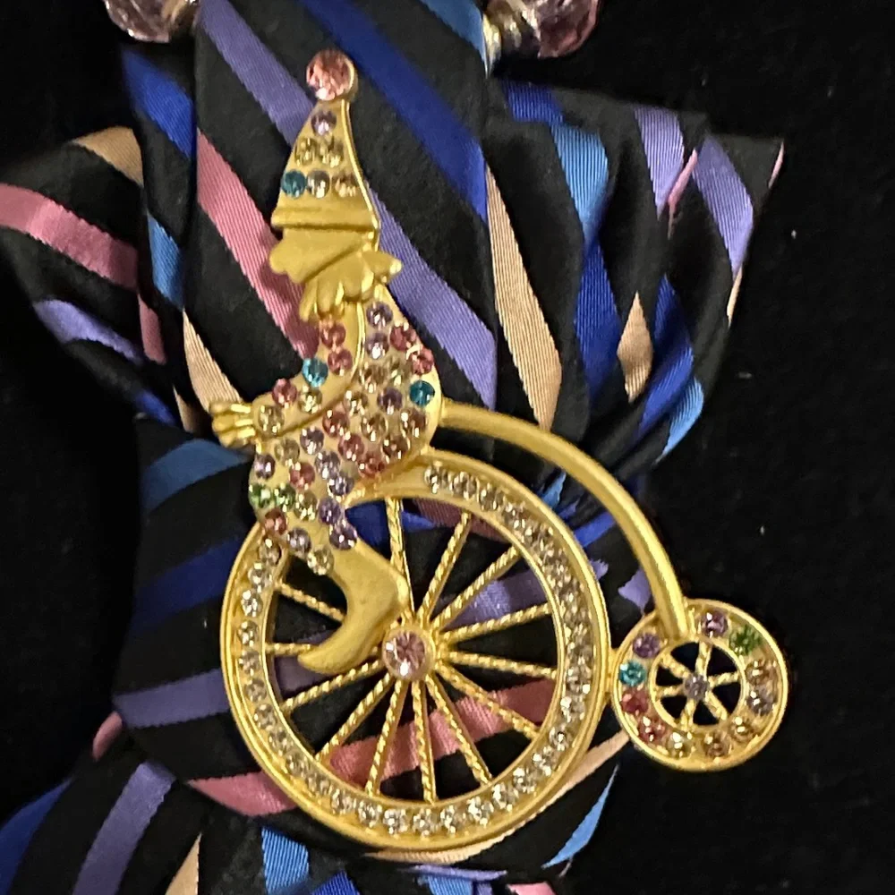 Multicolored vintage silk tie Necklace with a clown on a penny farthing brooch
